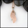 back view of custom opal and rose gold pendant
