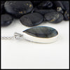 Profile view of labradorite cattail pendant