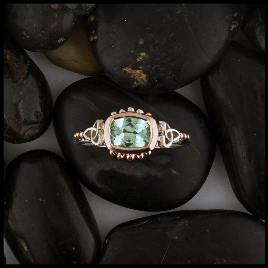 This Mint Garnet is set in a 14K Yellow and Rose Gold frame