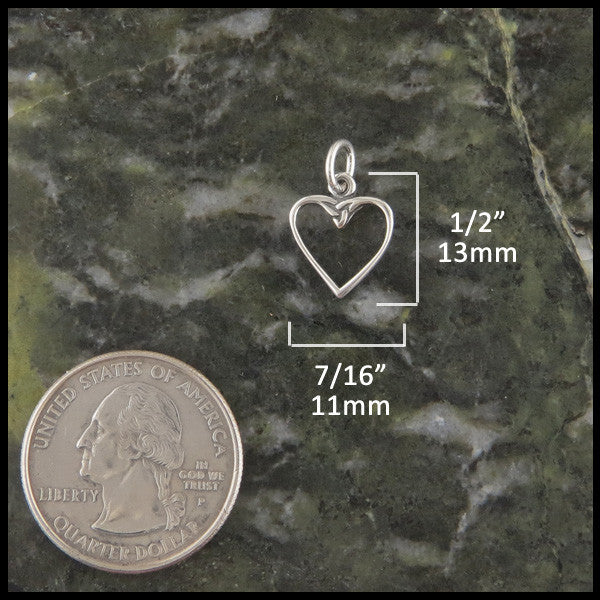 Dainty Celtic heart necklace in Sterling Silver measures 1/2" by 7/16"