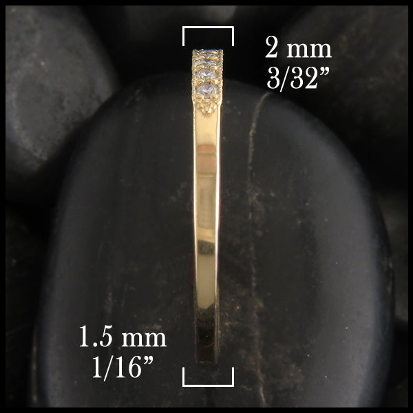 Side view of 14k yellow gold milgrain stacking ring with diamonds.  2 millimeters wide at the top tapers to 1 1/2 millimeters wide at the bottom