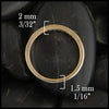 Through the finger view of 14k yellow gold milgrain stacking ring with diamonds.  2 millimeters thick at the top tapers to 1 1/2 millimeters thick at the bottom
