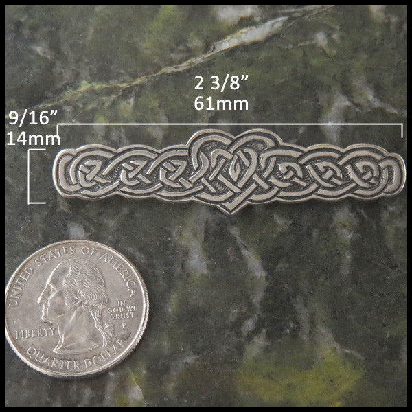 Heart Knot pin in Sterling Silver measures 9/16" by 2 3/8"