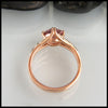 Profile view of malaya garnet ring