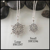 Small and large snowflake pendants