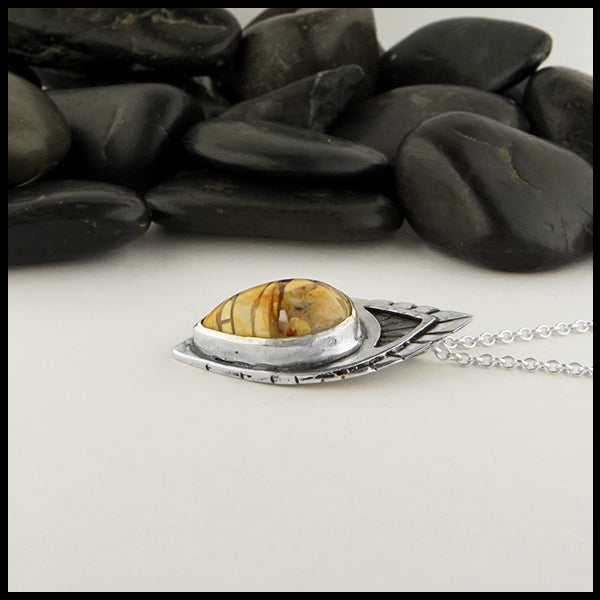 profile view of mookaite pendant