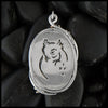 Owl detail on dDendritic opal pendant