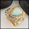 Ethiopian Opal Ring in yellow, rose, and white gold