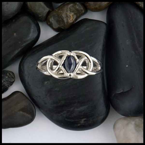 This 14K white gold ring is set with a 6X3 Marquise Sapphire stone. 