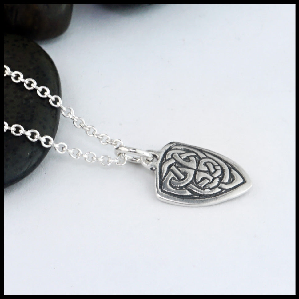 profile view of shield pendant