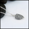 profile view of shield pendant